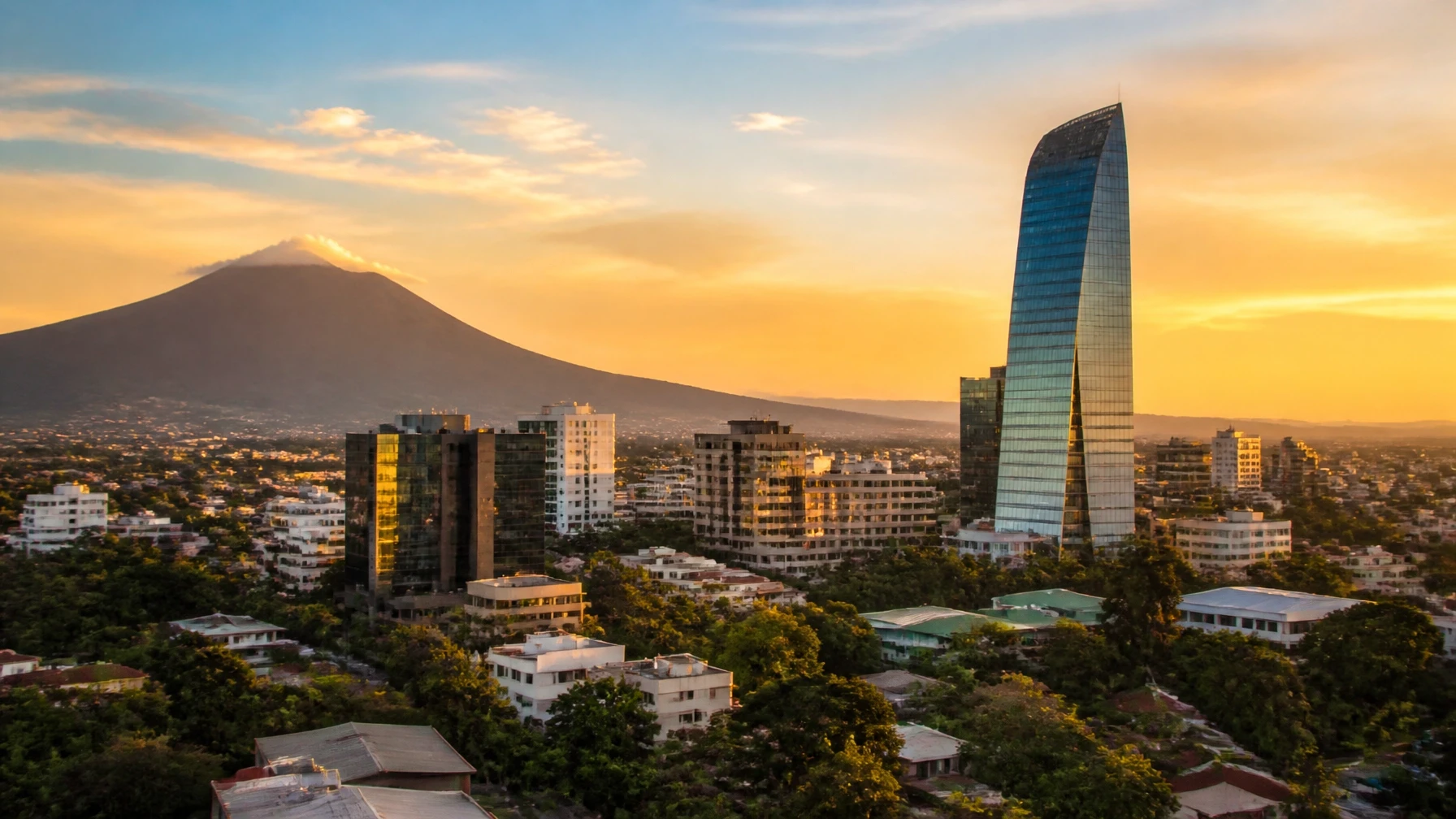 San Salvador skyline at sunset with volcano in the background